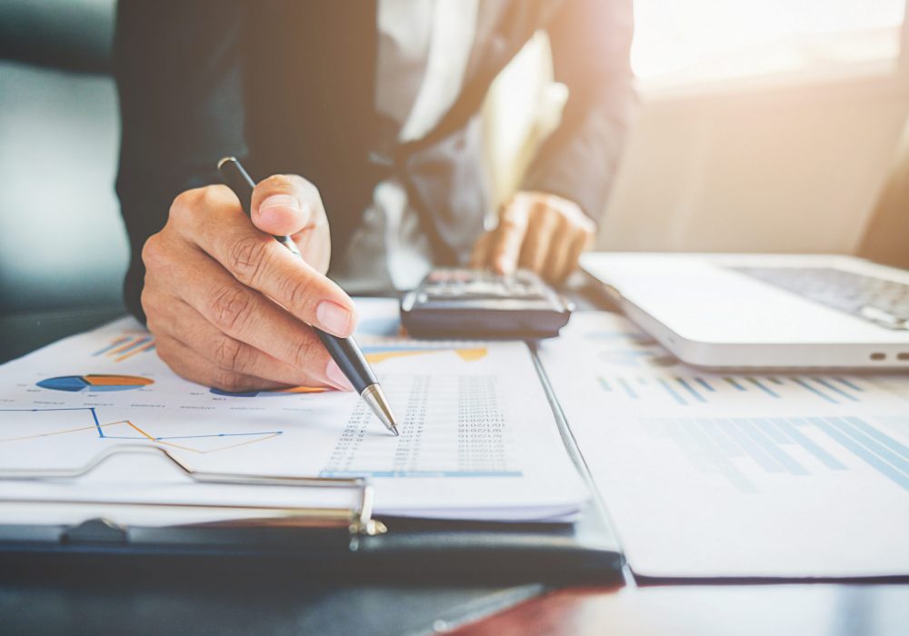 Business concept. Business people discussing the charts and graphs showing the results of their successful teamwork.