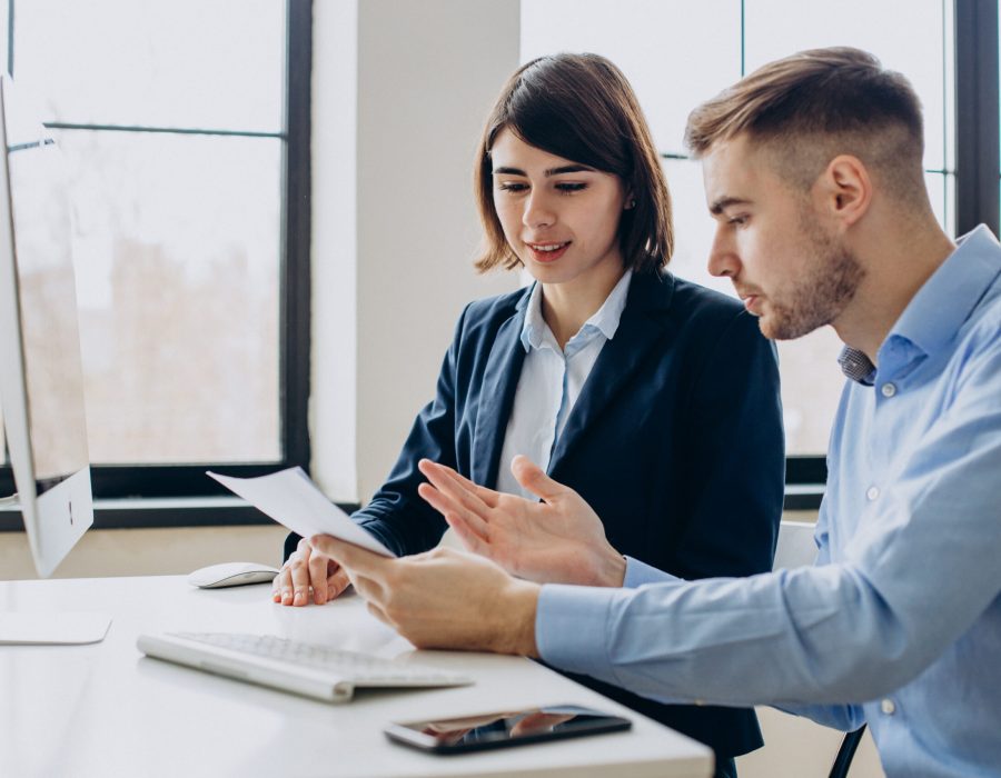 Business team working in office and discussing job issues